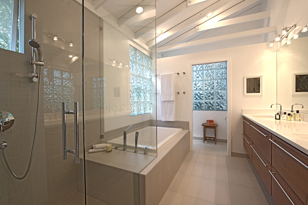 Design ideas for a mid-sized contemporary master bathroom in Seattle with an undermount sink, flat-panel cabinets, medium wood cabinets, engineered quartz benchtops, a freestanding tub, gray tile, ceramic tile, yellow walls, porcelain floors and a corner shower.