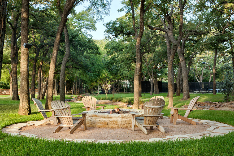 Inspiration for a traditional patio in Austin with a fire feature and no cover.