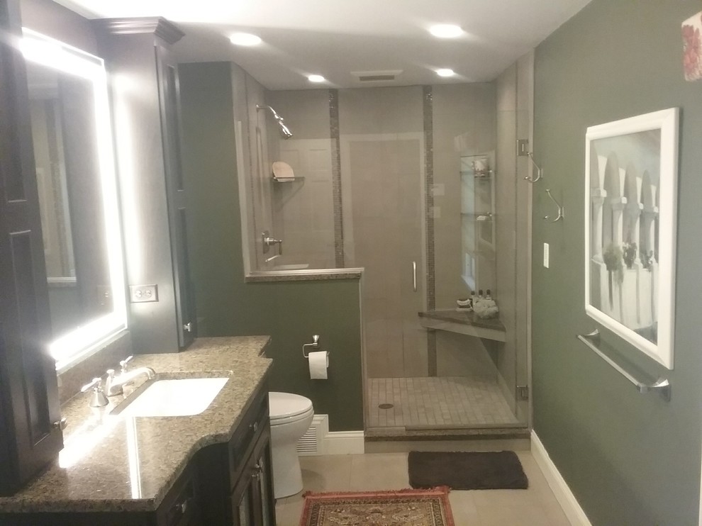 Large transitional master green tile alcove shower photo in Boston with shaker cabinets, black cabinets, granite countertops and beige countertops