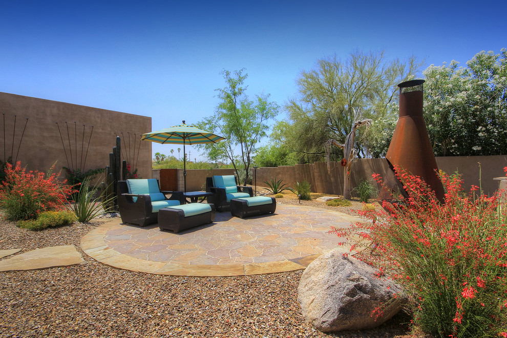 Inspiration for a large and desert look country side yard full sun xeriscape in Phoenix with concrete pavers.