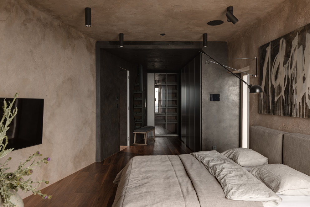 Mid-sized urban master medium tone wood floor and brown floor bedroom photo in Los Angeles with brown walls