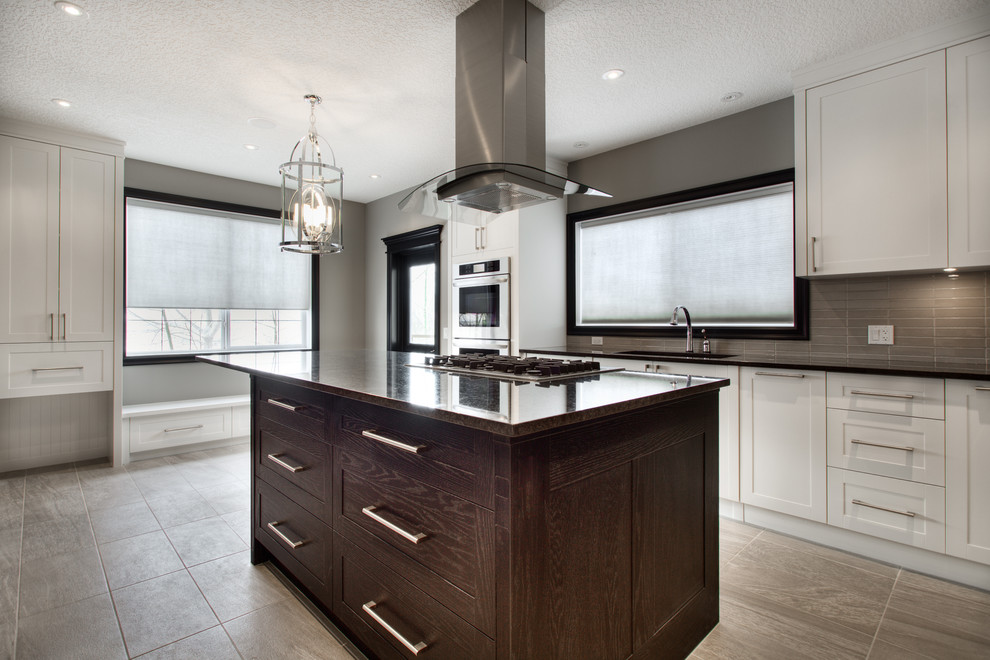 Example of a transitional kitchen design in Calgary