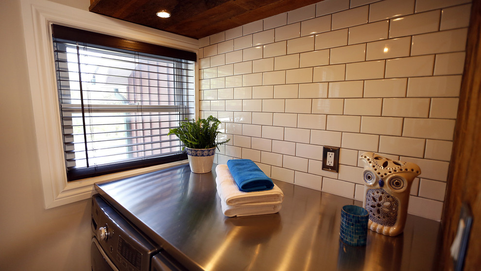 Mudroom - small transitional ceramic tile mudroom idea in Toronto with beige walls