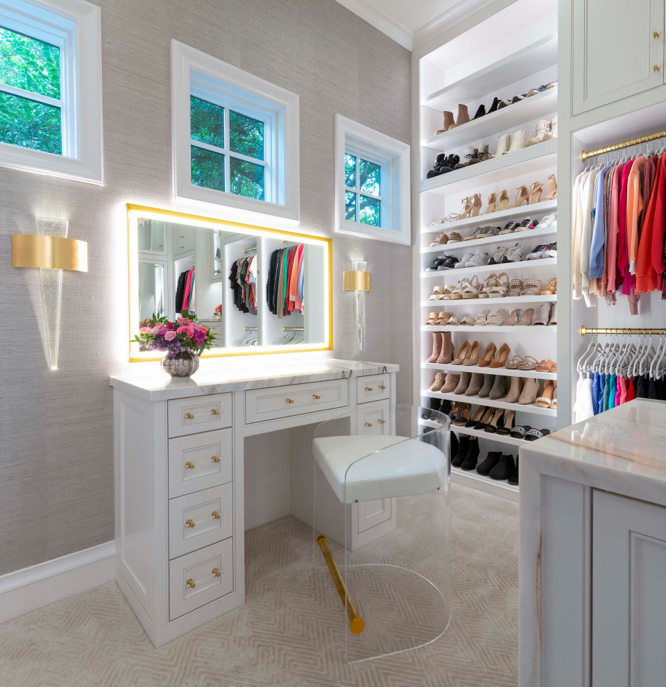 Example of a large transitional gender-neutral carpeted and beige floor walk-in closet design in Dallas with beaded inset cabinets and white cabinets