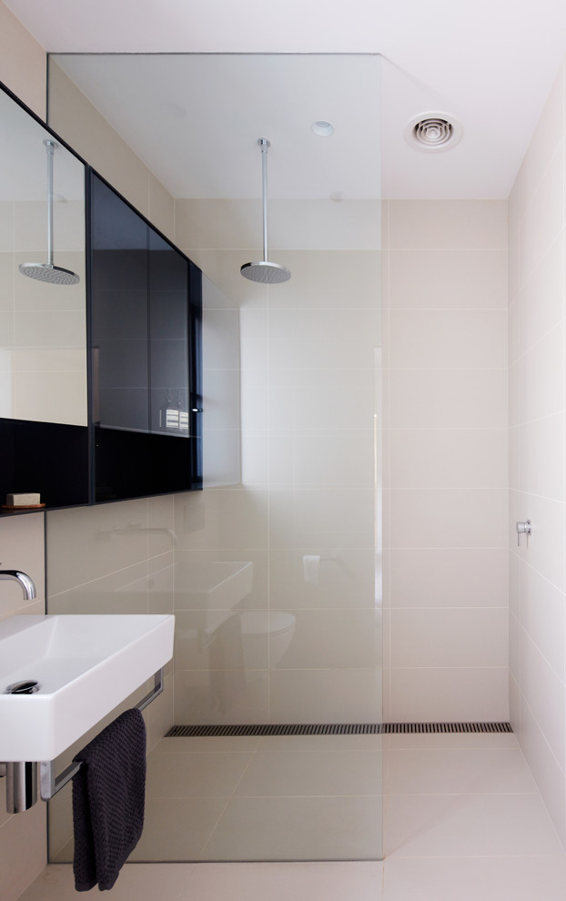 This is an example of a small contemporary bathroom in Melbourne with an open shower, beige tile, porcelain tile and porcelain floors.