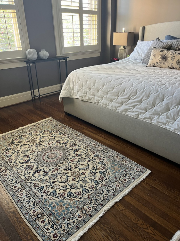 Nain Persian Rug with accents of silk adorns master bedroom suite