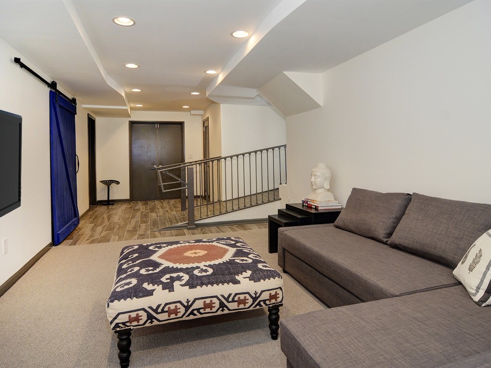 This is an example of an expansive contemporary basement in Newark.