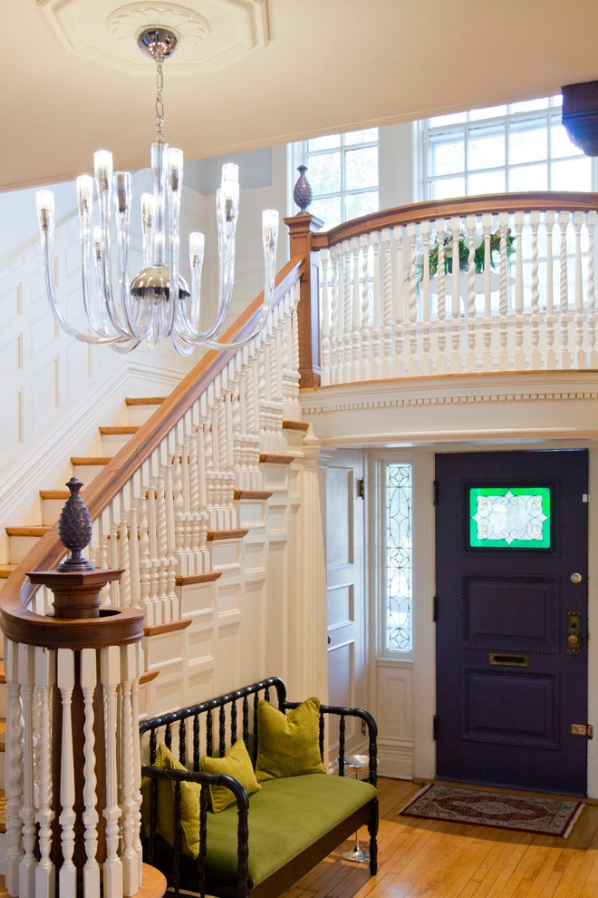 Design ideas for a mid-sized traditional foyer in St Louis with beige walls, medium hardwood floors, a single front door and a purple front door.