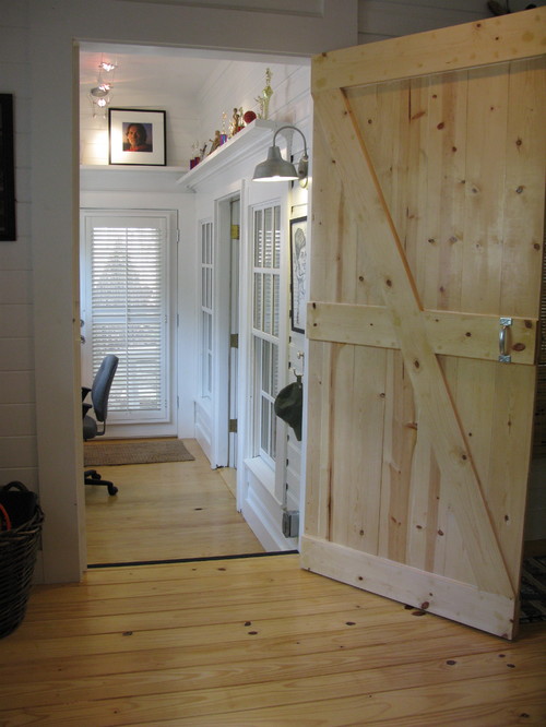 barn door opened to room with barn light