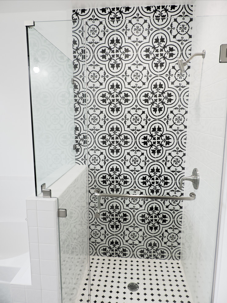 This is an example of a mid-sized master bathroom in Los Angeles with furniture-like cabinets, white cabinets, an alcove tub, an alcove shower, a two-piece toilet, black and white tile, porcelain tile, white walls, porcelain floors, a vessel sink, engineered quartz benchtops, white floor and black benchtops.