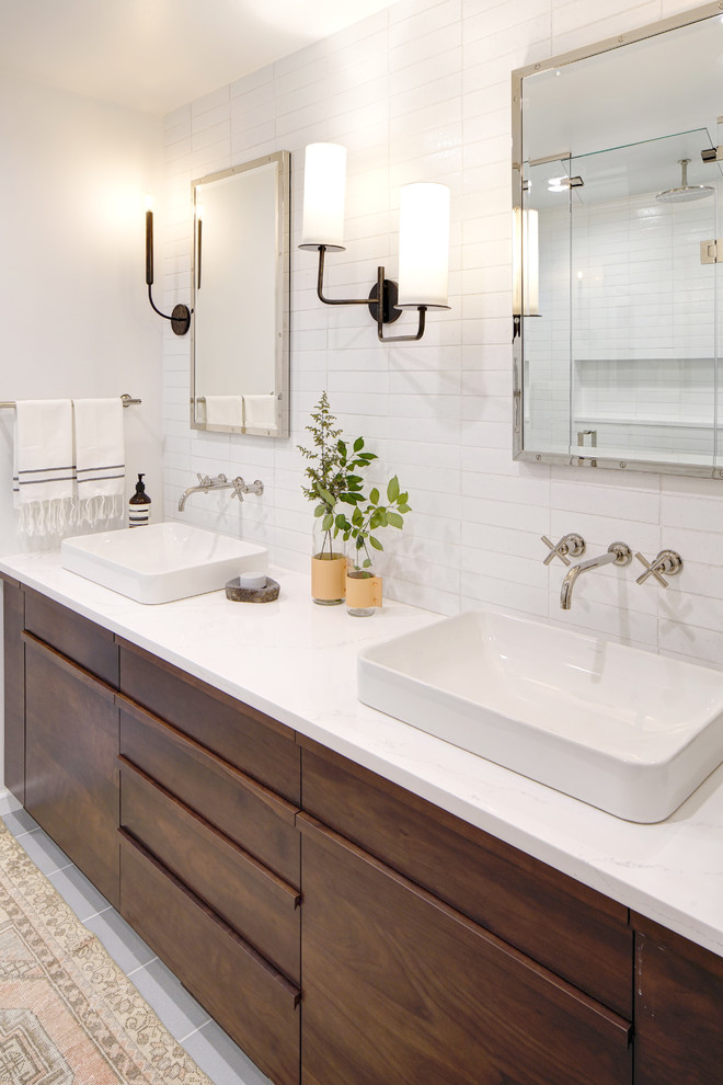Inspiration for a large contemporary master bathroom in Chicago with flat-panel cabinets, dark wood cabinets, white tile, porcelain tile, white walls, porcelain floors, a drop-in sink, engineered quartz benchtops and grey floor.