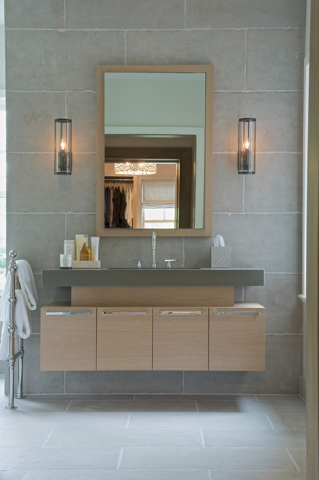 Photo of a transitional bathroom in New York with flat-panel cabinets and light wood cabinets.