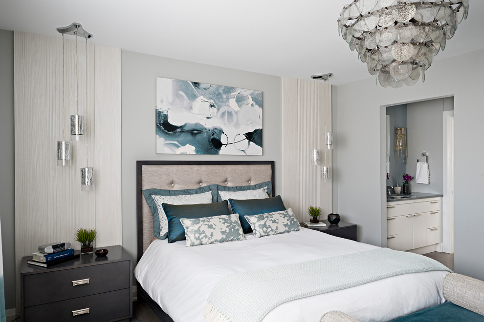 Inspiration for a mid-sized transitional master medium tone wood floor and brown floor bedroom remodel in Toronto with gray walls