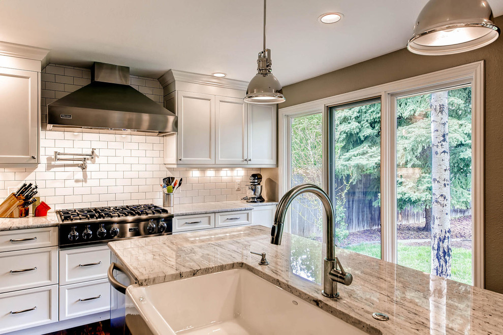 Example of a transitional kitchen design in Denver