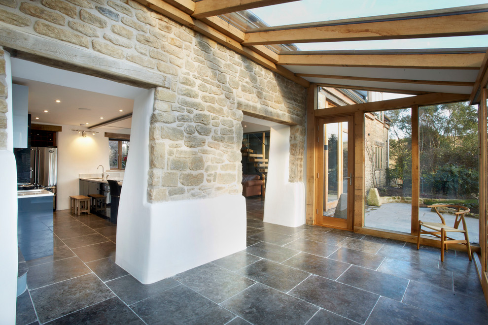 This is an example of a mid-sized traditional sunroom in Wiltshire.