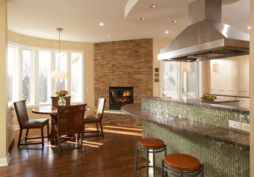 Design ideas for an eclectic eat-in kitchen in Minneapolis with flat-panel cabinets.