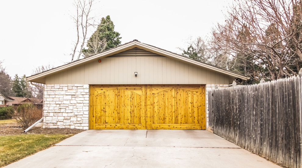 This is an example of a large traditional detached two-car garage in Denver.