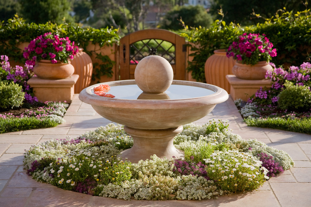 This is an example of a traditional garden in Santa Barbara with a water feature.