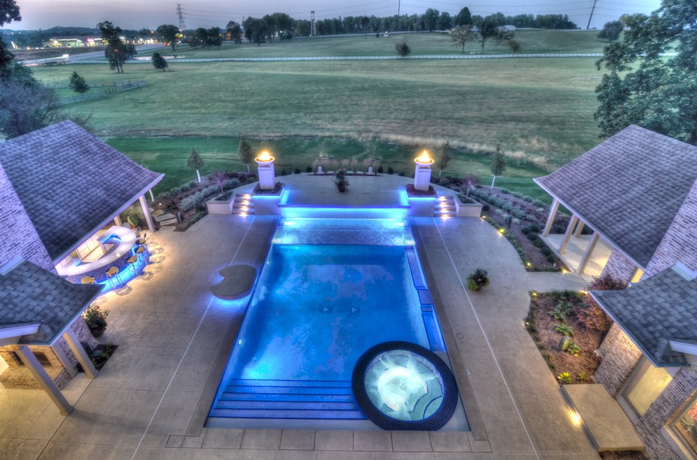 Hot tub - large transitional backyard concrete paver and rectangular natural hot tub idea in Cedar Rapids