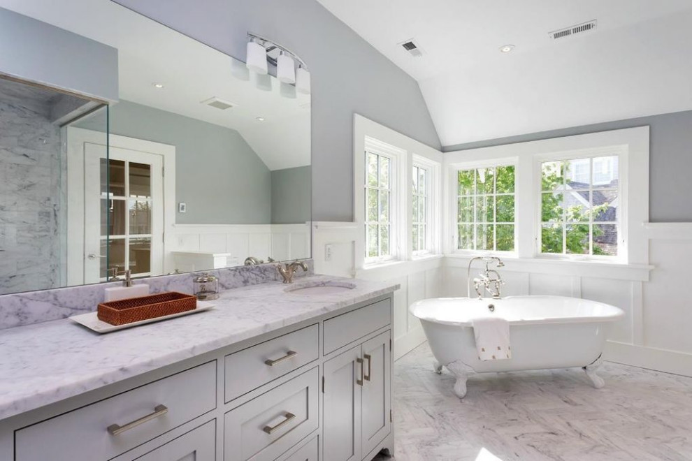 This is an example of a mid-sized arts and crafts master bathroom in Other with shaker cabinets, grey cabinets, a claw-foot tub, gray tile, marble, grey walls, marble floors, an undermount sink, grey floor, white benchtops, a double vanity and a built-in vanity.