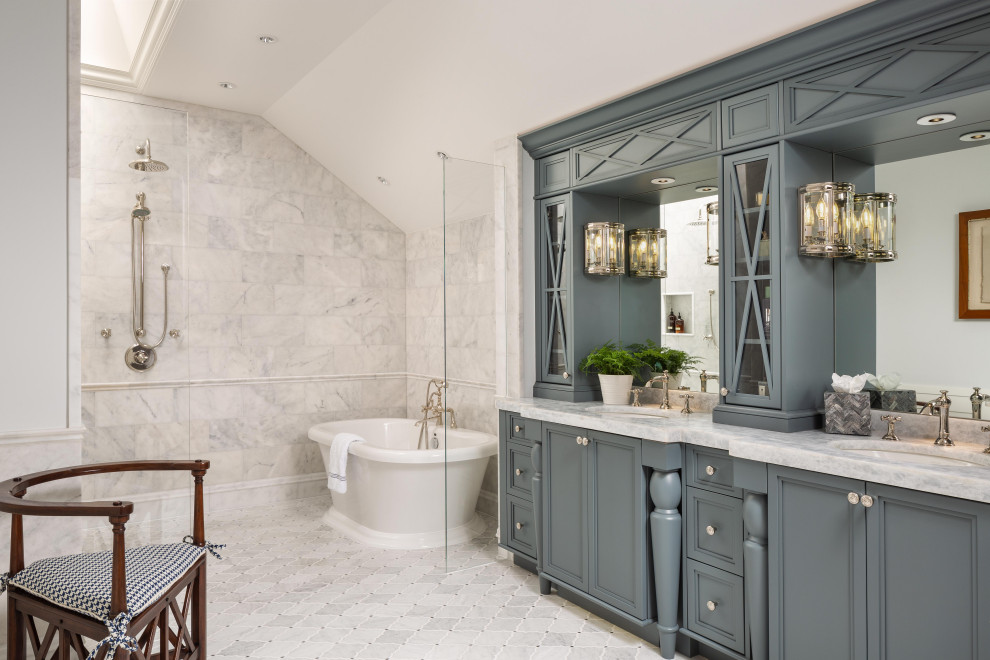 Inspiration for a traditional master wet room bathroom in Miami with recessed-panel cabinets, grey cabinets, a freestanding tub, gray tile, white walls, an undermount sink, grey floor, an open shower, grey benchtops, a double vanity and a built-in vanity.