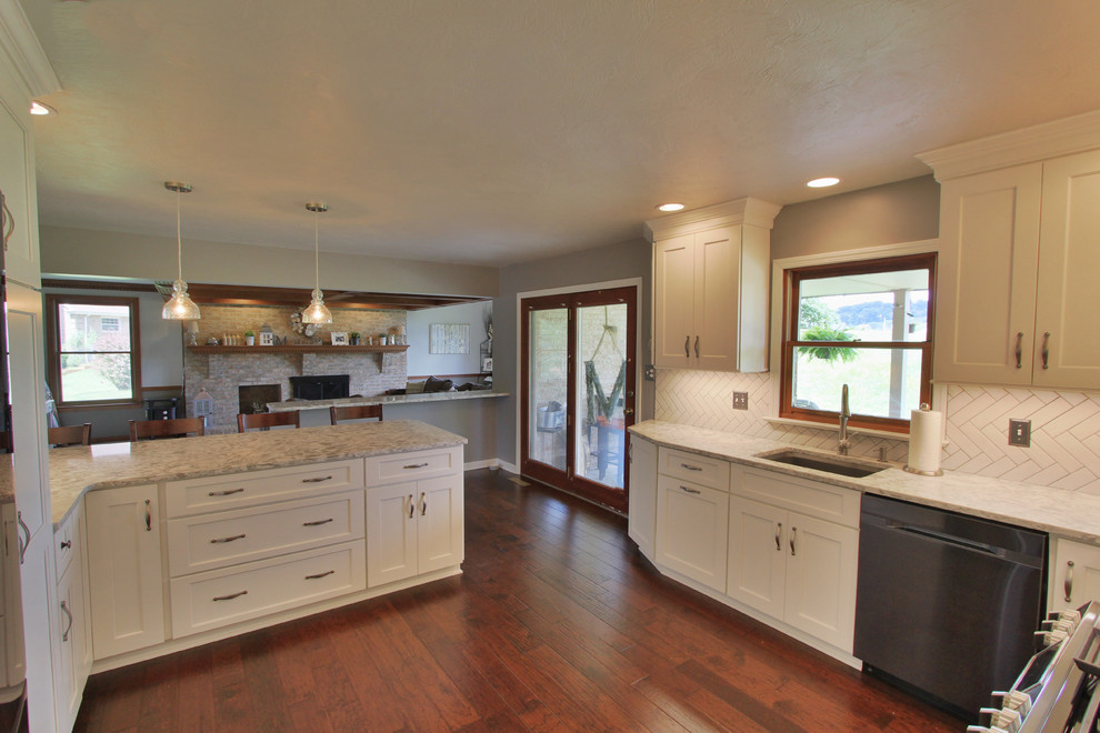 Inspiration for a mid-sized l-shaped dark wood floor eat-in kitchen remodel with an undermount sink, white cabinets, quartzite countertops, white backsplash, ceramic backsplash, black appliances and no island