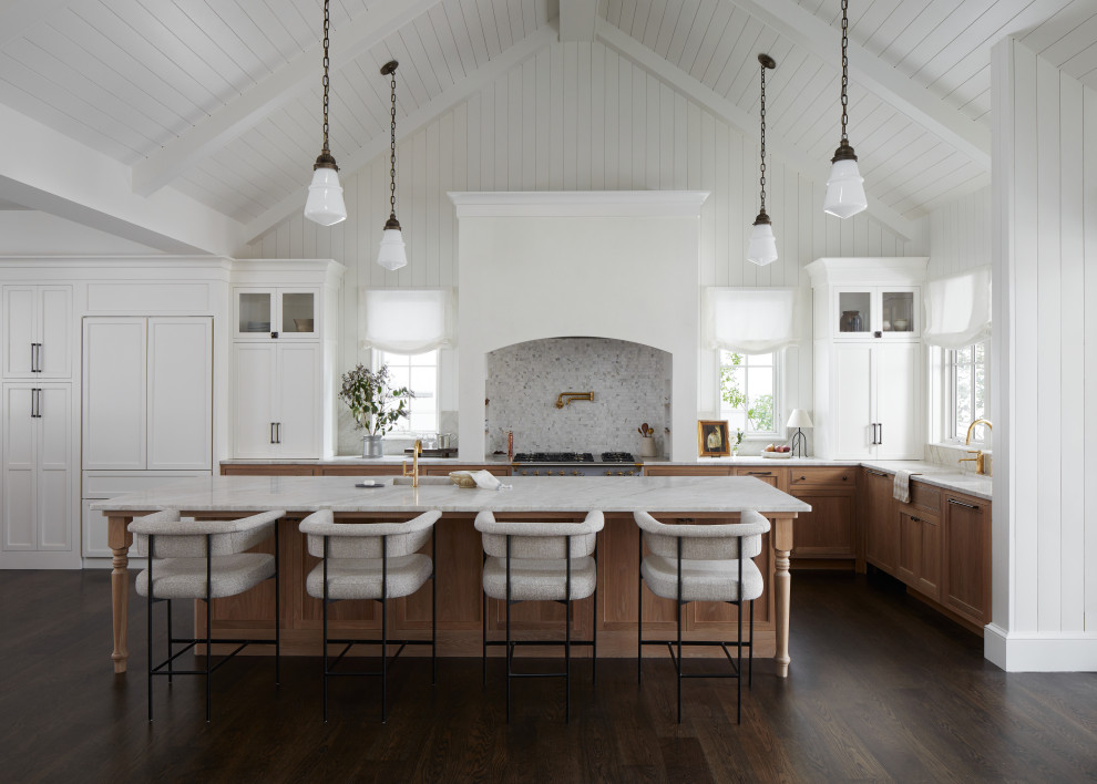 Transitional l-shaped dark wood floor, brown floor, exposed beam, shiplap ceiling and vaulted ceiling kitchen photo in Other with an undermount sink, shaker cabinets, medium tone wood cabinets, paneled appliances, an island and white countertops