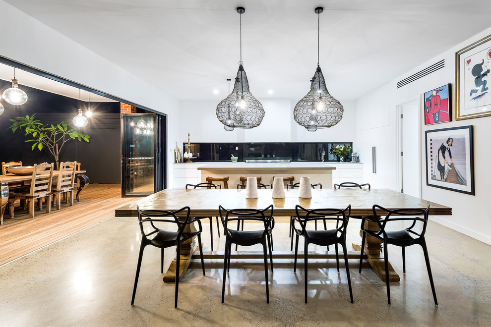 Design ideas for a contemporary kitchen/dining combo in Adelaide with white walls, concrete floors and grey floor.