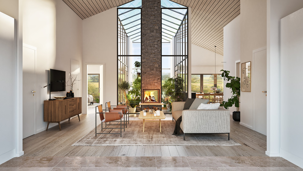 Design ideas for a mid-sized contemporary open concept living room in Malmo with a two-sided fireplace.