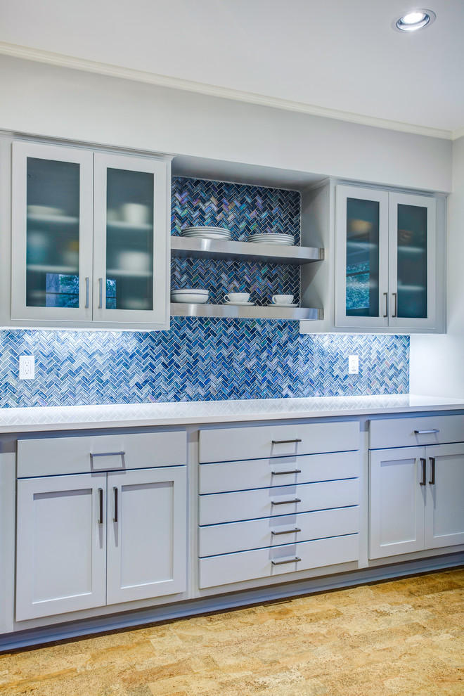 Inspiration for a large modern l-shaped eat-in kitchen in Dallas with an undermount sink, shaker cabinets, blue cabinets, quartz benchtops, blue splashback, mosaic tile splashback, stainless steel appliances, cork floors, with island, brown floor and white benchtop.