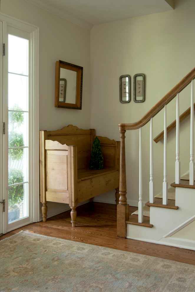 Small traditional foyer in Other with beige walls, medium hardwood floors, a single front door and a white front door.
