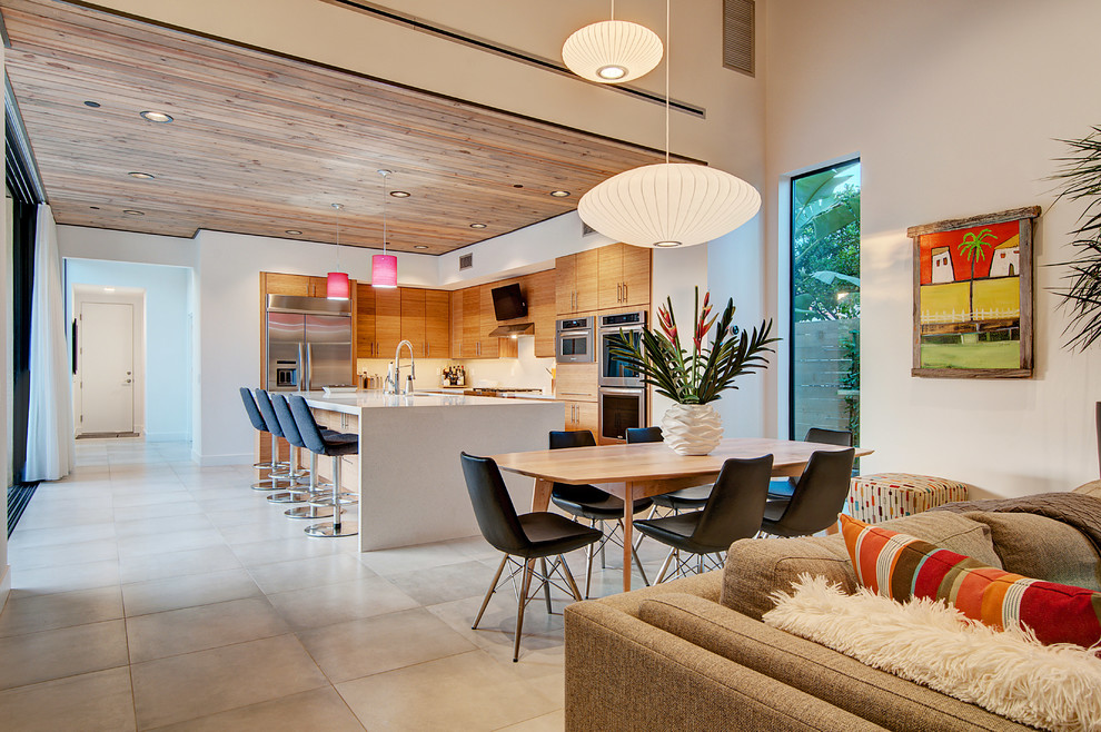 Inspiration for a contemporary open plan dining in Orange County with grey floor.