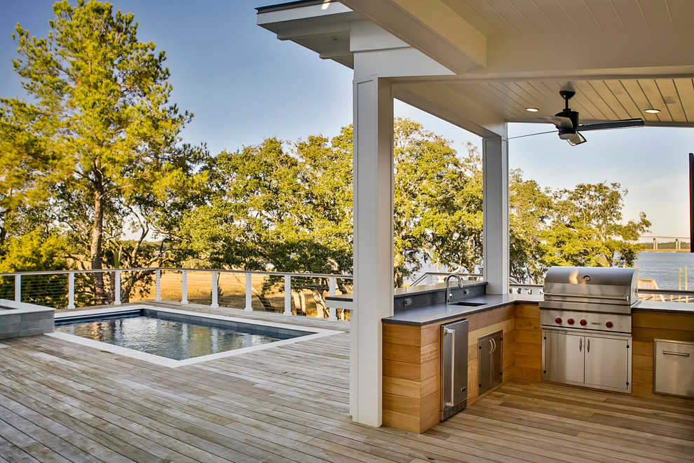 Inspiration for a mid-sized modern backyard rectangular aboveground pool in Charleston with a hot tub and decking.