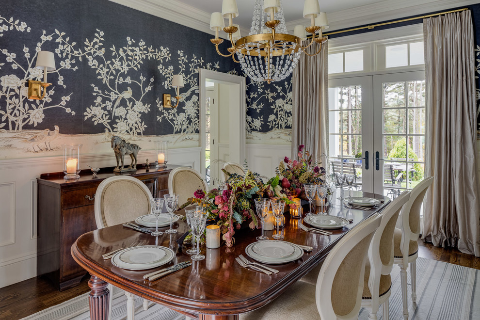 This is an example of a mid-sized country separate dining room in Boston with no fireplace, multi-coloured walls and dark hardwood floors.