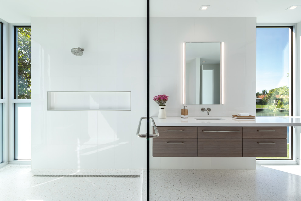 Inspiration for a mid-sized modern master bathroom in Tampa with flat-panel cabinets, dark wood cabinets, a double shower, white tile, porcelain tile, white walls, concrete floors, an undermount sink, quartzite benchtops, white floor, an open shower and white benchtops.