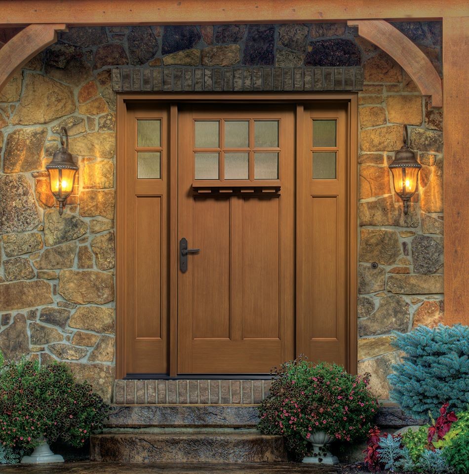 Design ideas for a mid-sized arts and crafts front door in Indianapolis with a single front door and a medium wood front door.