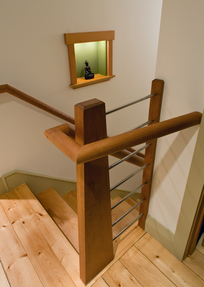 Photo of a mid-sized traditional wood straight staircase in Bridgeport with wood risers and wood railing.