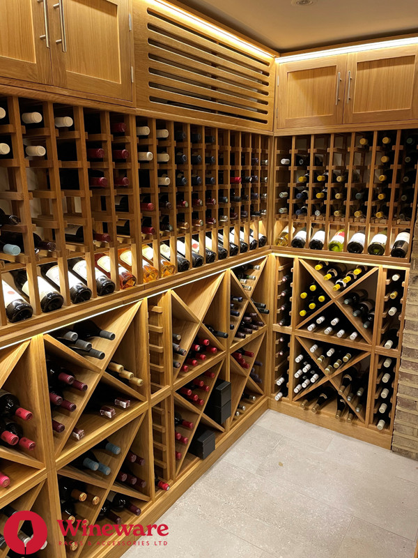 Inspiration for a large contemporary wine cellar in London with storage racks.