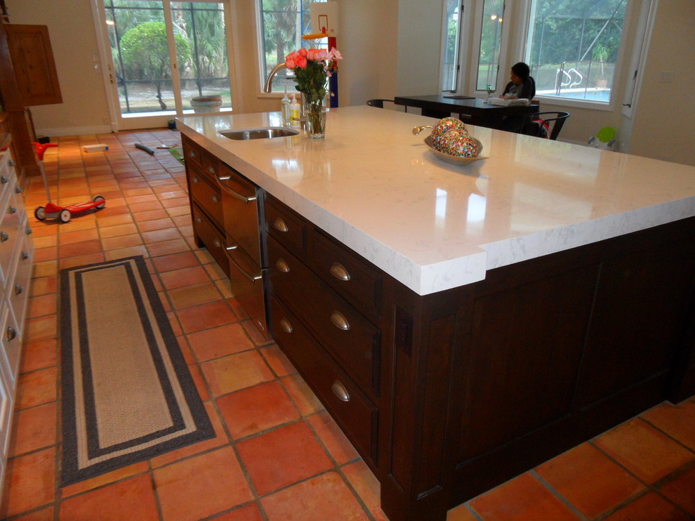 Large transitional l-shaped eat-in kitchen photo in Miami with an undermount sink, shaker cabinets, white cabinets, quartz countertops, white backsplash, ceramic backsplash, stainless steel appliances and an island