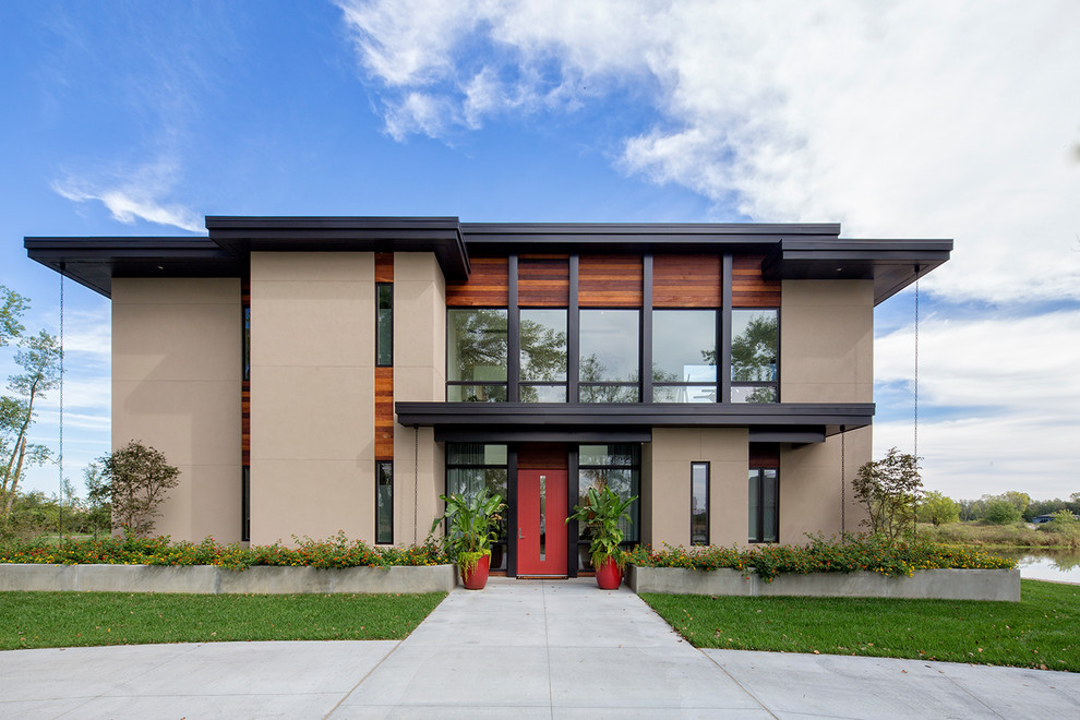 Contemporary brown two-story mixed siding flat roof idea in Omaha