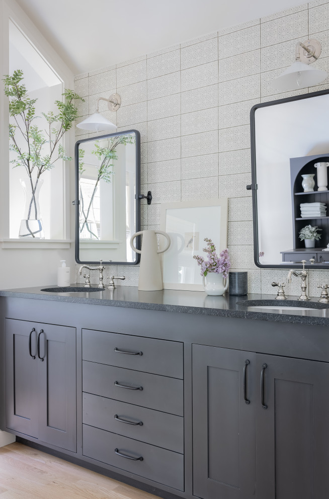 Large country master bathroom in Boston with flat-panel cabinets, black cabinets, an open shower, black and white tile, ceramic tile, white walls, light hardwood floors, granite benchtops, a hinged shower door, a single vanity and a built-in vanity.
