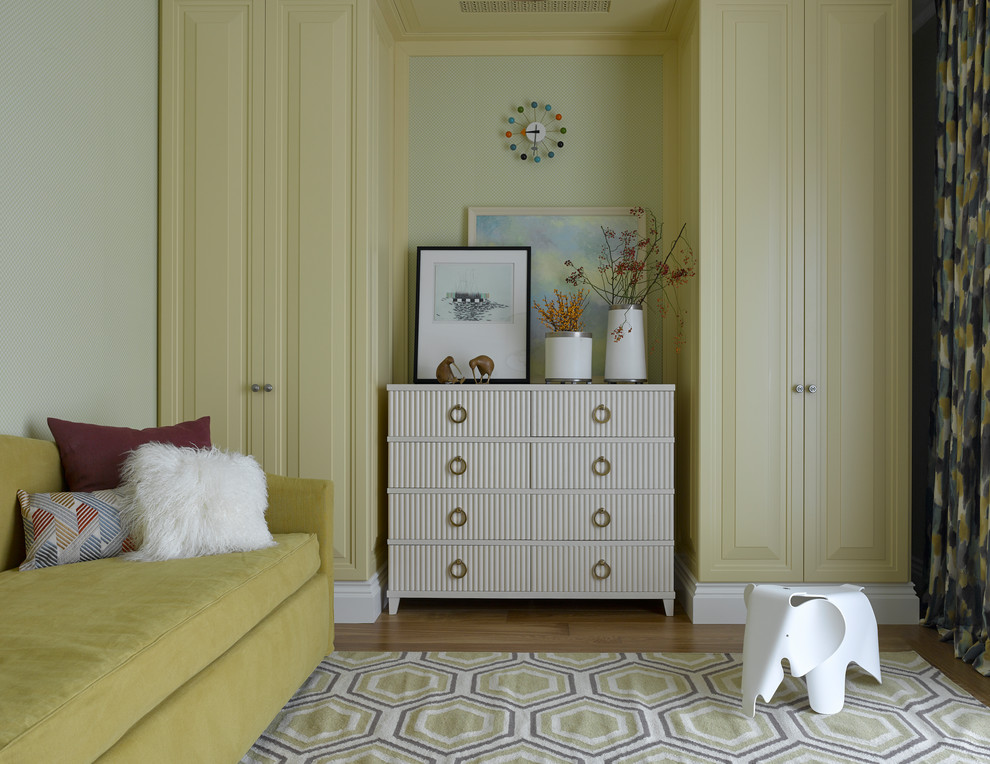 Inspiration for a mid-sized transitional gender-neutral kids' playroom for kids 4-10 years old in Moscow with yellow walls, medium hardwood floors and brown floor.