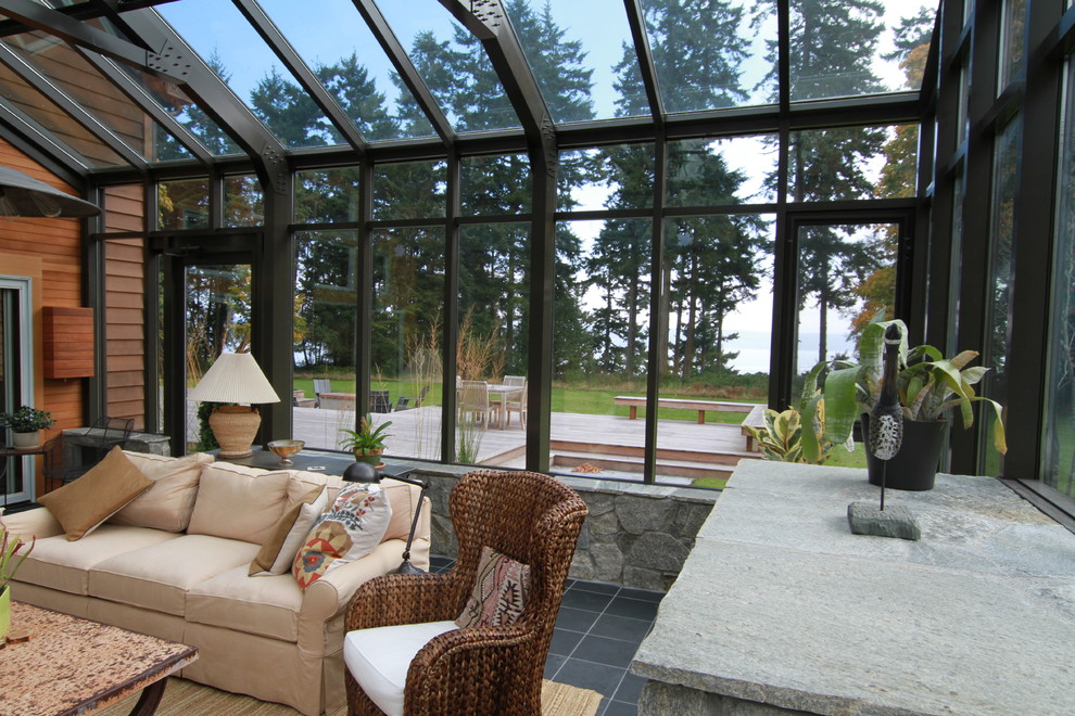 This is an example of an expansive contemporary sunroom in Vancouver.
