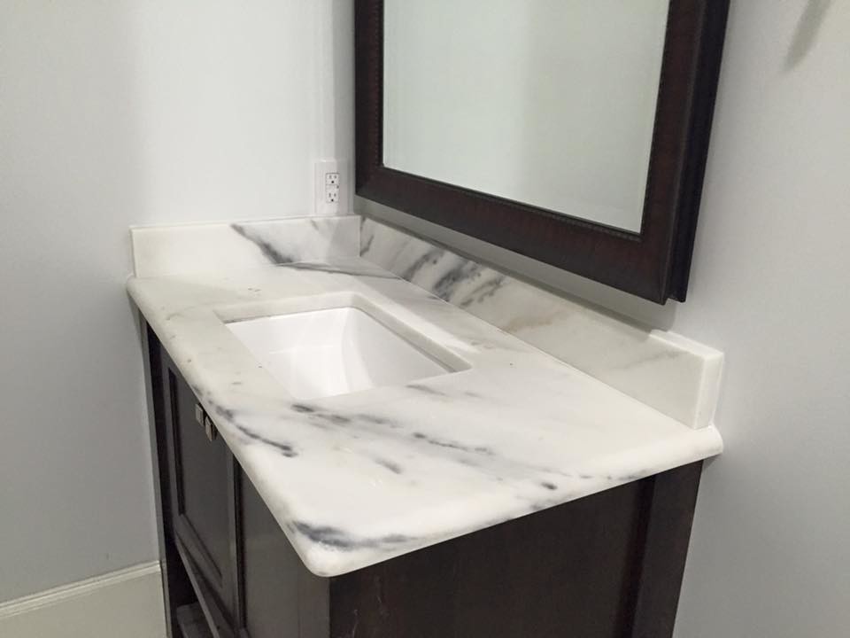 Mid-sized transitional master ceramic tile bathroom photo in Dallas with recessed-panel cabinets, black cabinets, white walls, an undermount sink and marble countertops