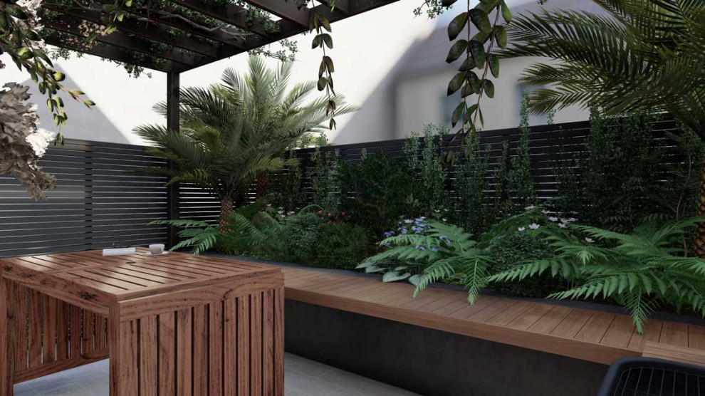 Réalisation d'une petite terrasse design avec une cour, des pavés en pierre naturelle et une pergola.