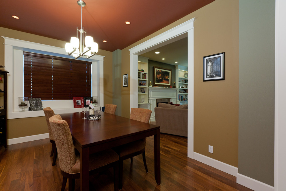 This is an example of a mid-sized traditional dining room in Seattle with beige walls, medium hardwood floors and no fireplace.