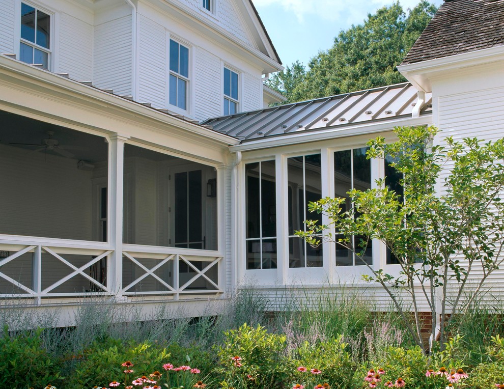 Inspiration for a large traditional three-storey white exterior in Baltimore with wood siding.