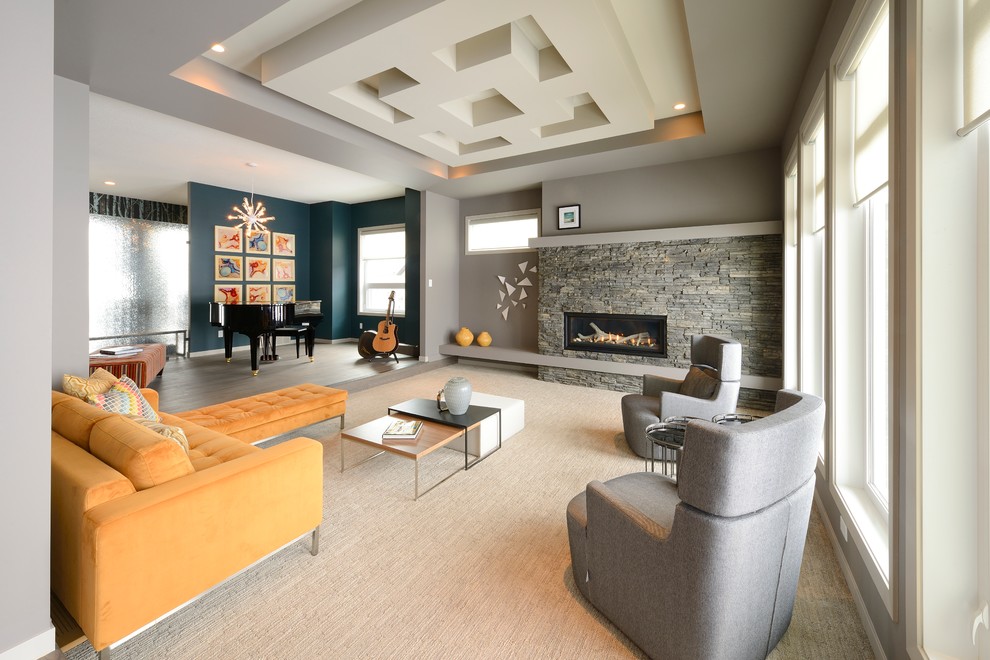 Living room - large contemporary open concept carpeted living room idea in Edmonton with gray walls, a ribbon fireplace and a stone fireplace