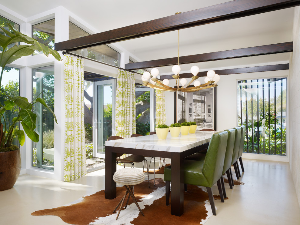 This is an example of a contemporary dining room in Orange County with white walls.