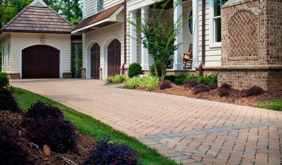 Inspiration for a small traditional front yard patio in Other with brick pavers and a roof extension.